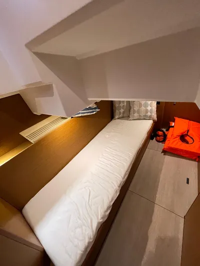  Yacht Photos Pics 2024 Beneteau Swift Trawler 41 Fly cabin interior with bed and modern design.