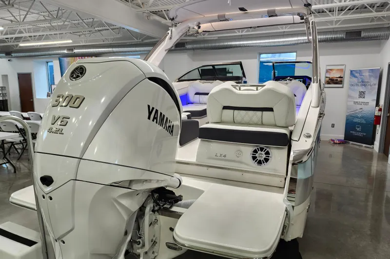  Yacht Photos Pics 2025 Regal LX4 boat with Yamaha 300 V6 engine in showroom.