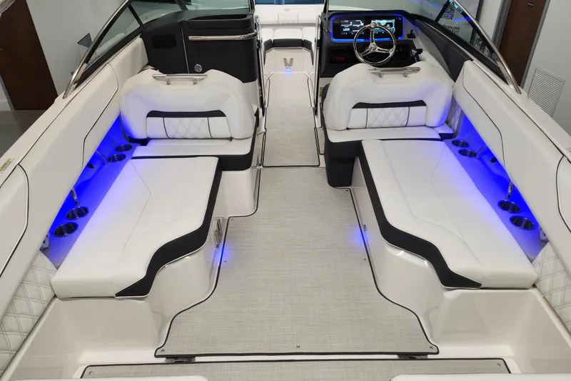  Yacht Photos Pics Luxurious 2025 Regal LX4 boat interior with white seating and blue LED lighting.