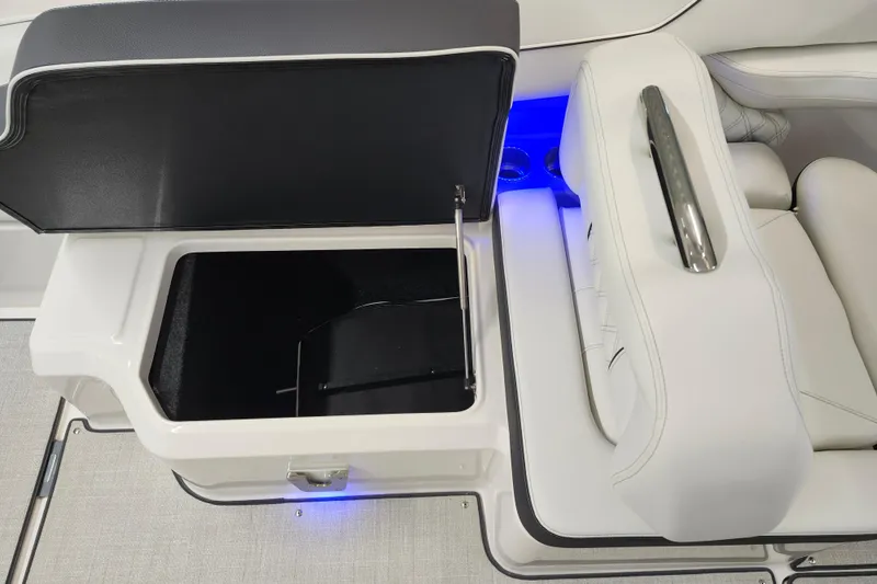  Yacht Photos Pics 2025 Regal LX4 boat interior with open storage compartment and blue LED lighting.