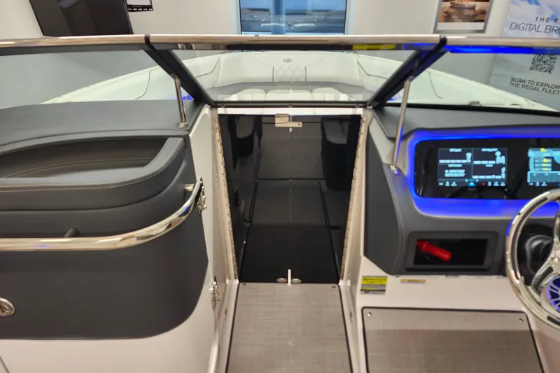  Yacht Photos Pics 2025 Regal LX4 boat interior with modern dashboard and seating area.