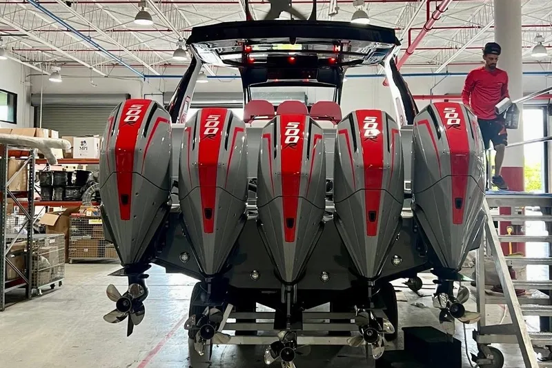  Yacht Photos Pics 2026 Cigarette 42' Auroris with five powerful outboard engines in a workshop setting.