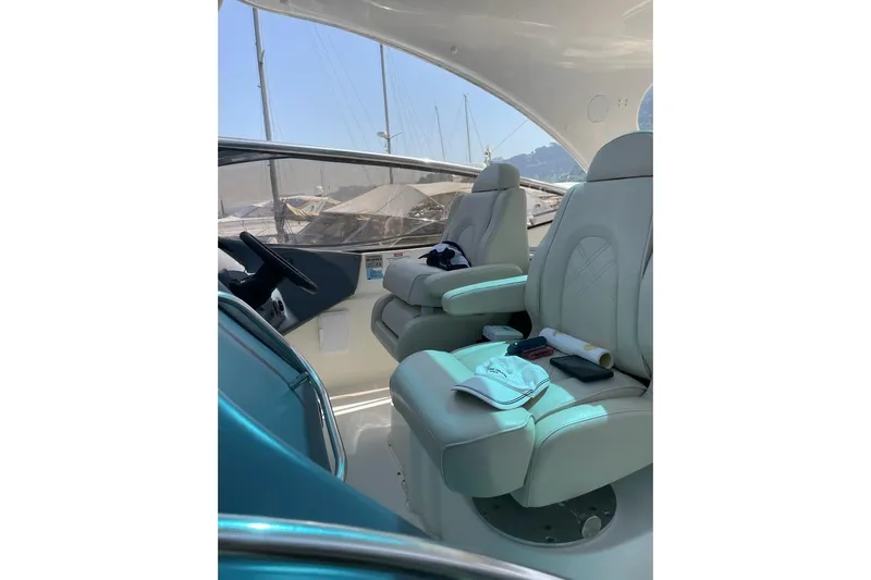  Yacht Photos Pics 2003 Cruisers Yachts 5470 Express cockpit with luxurious seating and helm controls.