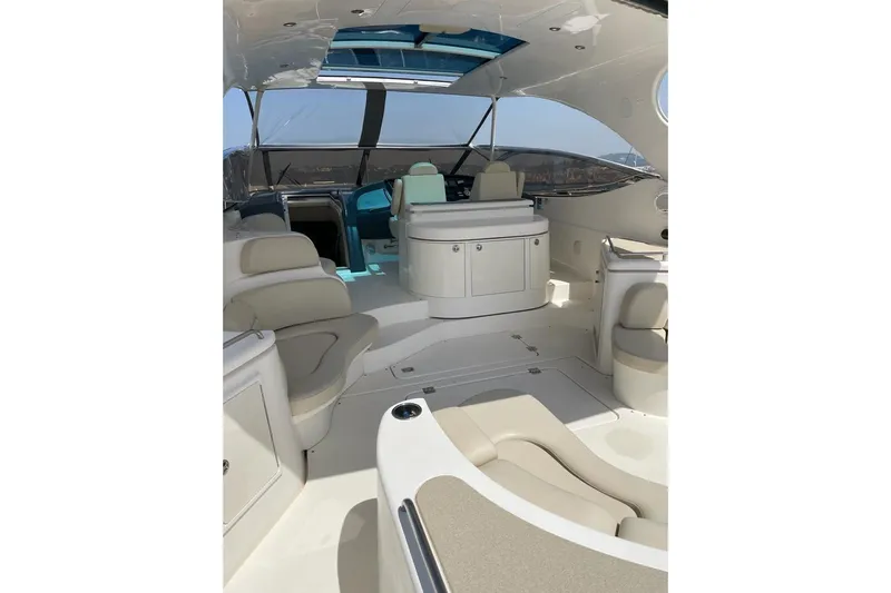  Yacht Photos Pics Luxurious 2003 Cruisers Yachts 5470 Express interior with elegant seating and modern design.