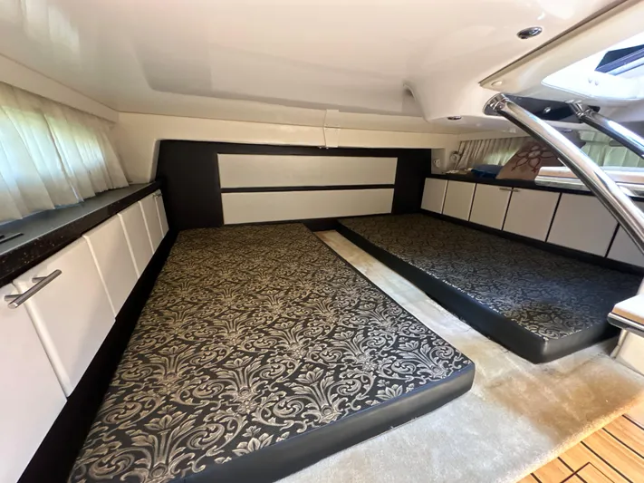 Sick If Needed Yacht Photos Pics 2015 Regal 32 Express cabin interior with patterned bedding and modern design.