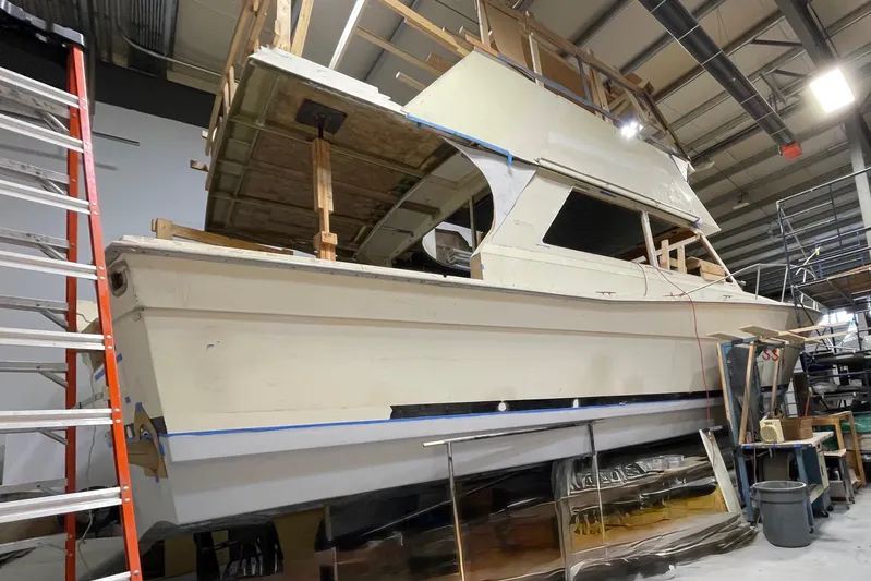  Yacht Photos Pics 1983 Viking Boats Sportfish 46 Sedan Bridge under restoration in a workshop.