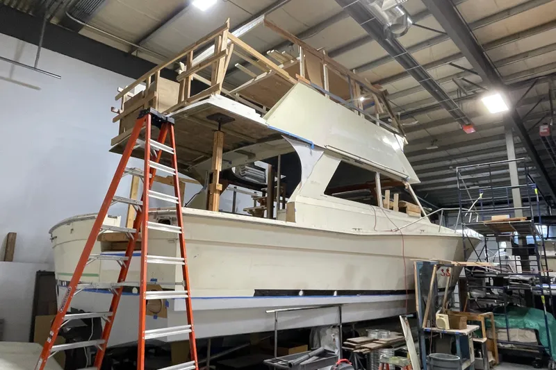  Yacht Photos Pics 1983 Viking Boats Sportfish 46 Sedan Bridge under renovation in a workshop.