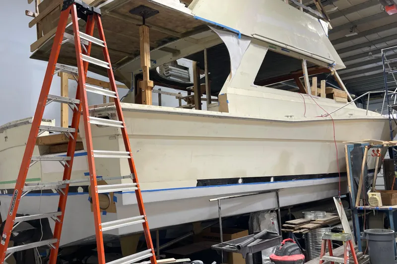  Yacht Photos Pics 1983 Viking Sportfish 46 Sedan Bridge under restoration in a workshop.