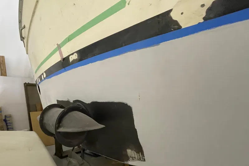  Yacht Photos Pics 1983 Viking Boats Sportfish 46 Sedan Bridge undergoing hull maintenance in a workshop.