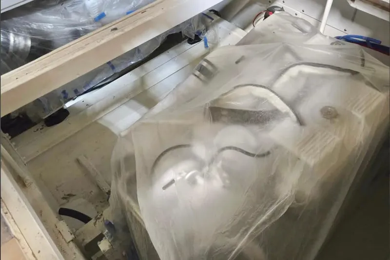  Yacht Photos Pics Engine compartment of 1983 Viking Boats Sportfish 46 Sedan Bridge, covered for protection.