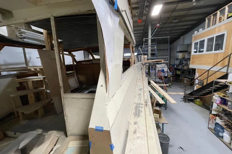  Yacht Photos Pics 1983 Viking Boats Sportfish 46 Sedan Bridge under restoration in a workshop.