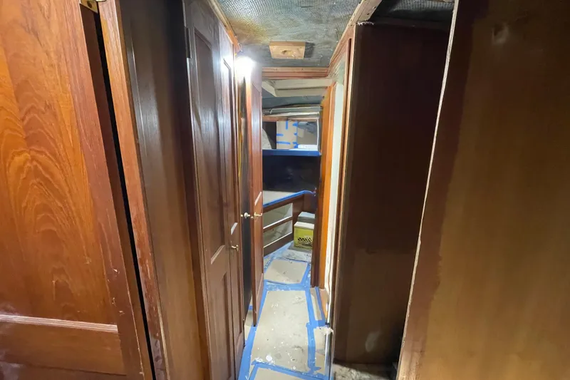  Yacht Photos Pics Interior hallway of 1983 Viking Boats Sportfish 46 Sedan Bridge with wooden paneling.