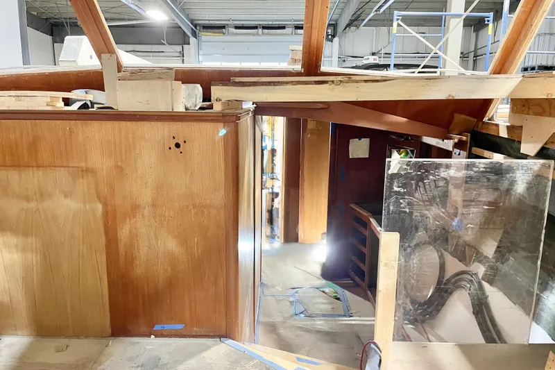  Yacht Photos Pics 1983 Viking Boats Sportfish 46 Sedan Bridge under renovation in a workshop.