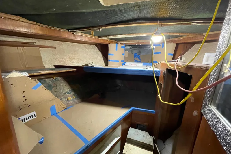  Yacht Photos Pics 1983 Viking Boats Sportfish 46 Sedan Bridge interior under renovation with exposed wiring and cardboard.