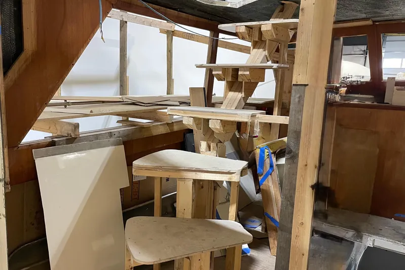  Yacht Photos Pics Interior renovation of 1983 Viking Boats Sportfish 46 Sedan Bridge, showcasing wooden framework.