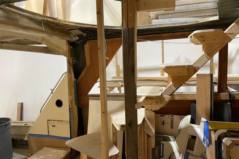  Yacht Photos Pics 1983 Viking Boats Sportfish 46 Sedan Bridge under renovation, showcasing interior wooden framework.