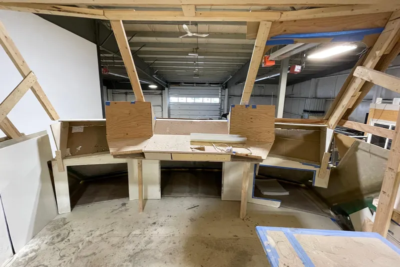  Yacht Photos Pics 1983 Viking Boats Sportfish 46 Sedan Bridge under construction in a workshop.