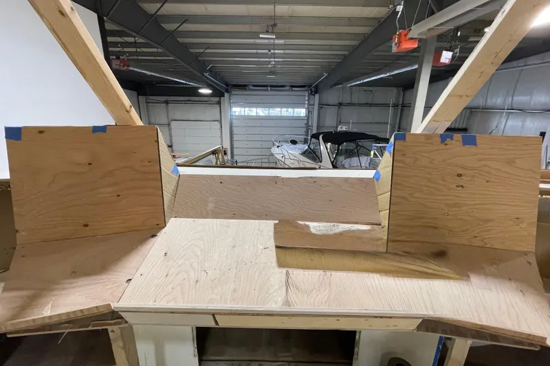  Yacht Photos Pics 1983 Viking Boats Sportfish 46 Sedan Bridge under construction in a workshop.