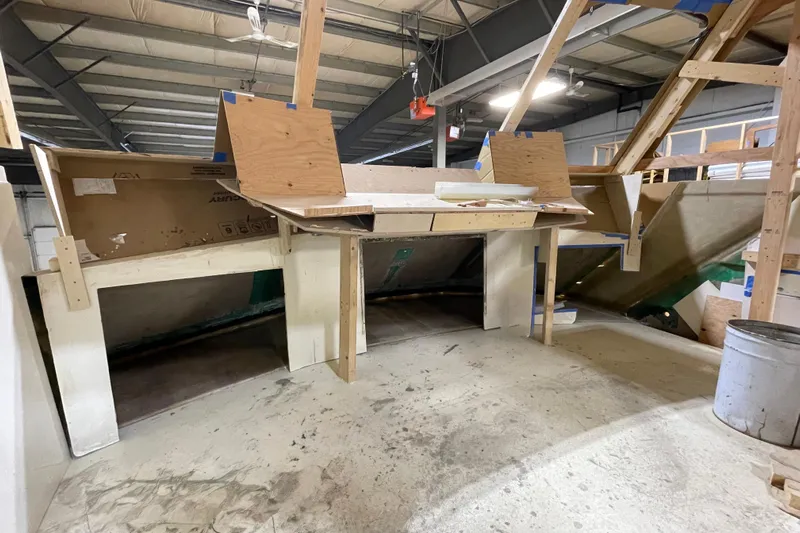  Yacht Photos Pics 1983 Viking Boats Sportfish 46 Sedan Bridge under construction in a workshop.