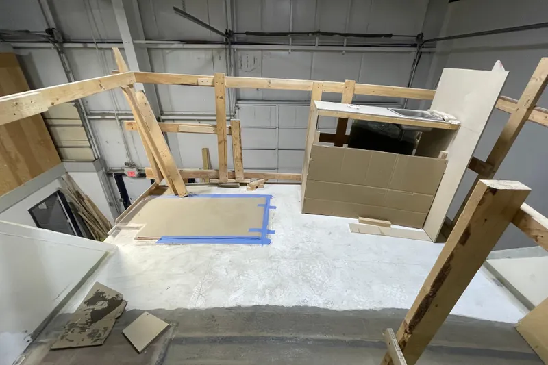  Yacht Photos Pics 1983 Viking Boats Sportfish 46 Sedan Bridge under renovation, featuring wooden framework and construction materials.