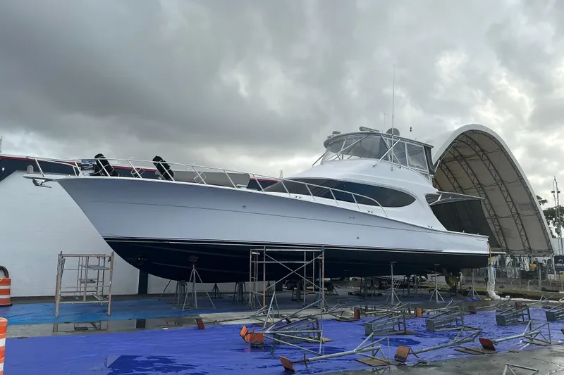  Yacht Photos Pics 2016 Hatteras GT63 yacht on dry dock under cloudy skies.