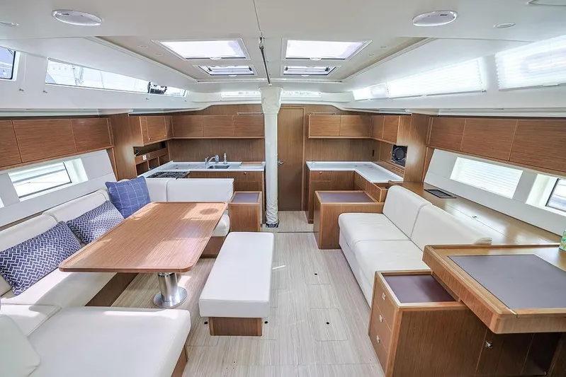 Das Boot Yacht Photos Pics Luxurious interior of 2020 Bavaria C57 yacht with modern kitchen and seating area.