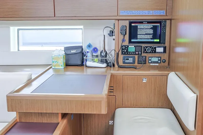 Das Boot Yacht Photos Pics Navigation station in 2020 Bavaria C57 yacht with control panels and seating.