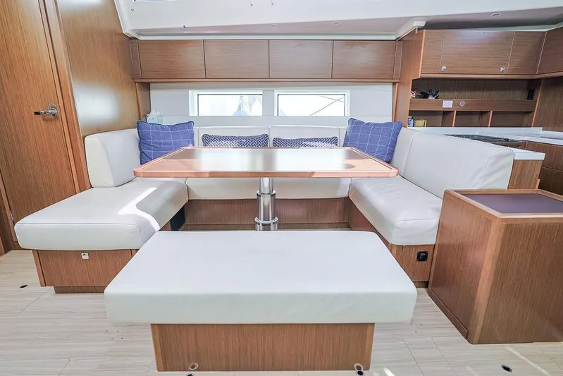 Das Boot Yacht Photos Pics Luxurious interior of 2020 Bavaria C57 yacht with cozy seating and modern wooden finishes.