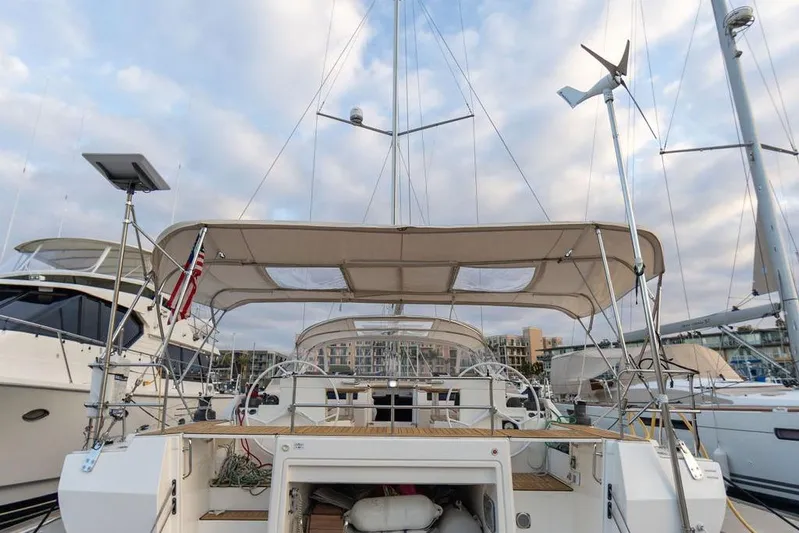Das Boot Yacht Photos Pics Modern Bavaria C57 yacht docked at marina, showcasing spacious deck and elegant design, 2020 model.