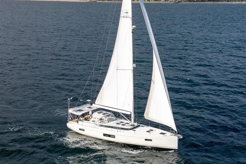 Das Boot Yacht Photos Pics Sailing yacht Bavaria C57 2020 gliding on open sea with full sails.