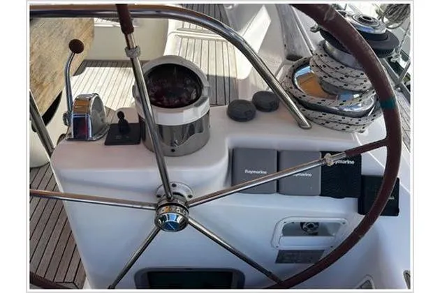  Yacht Photos Pics Steering wheel and controls of 2004 Jeanneau Sun Odyssey 54 DS sailboat.