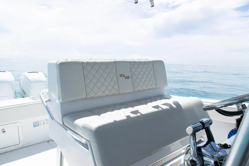  Yacht Photos Pics 2006 SeaVee 340B boat interior with cushioned seating and ocean view.