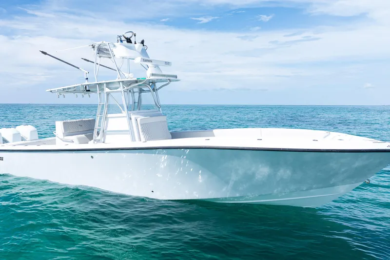  Yacht Photos Pics 2006 SeaVee 340B boat on clear ocean water under a blue sky.