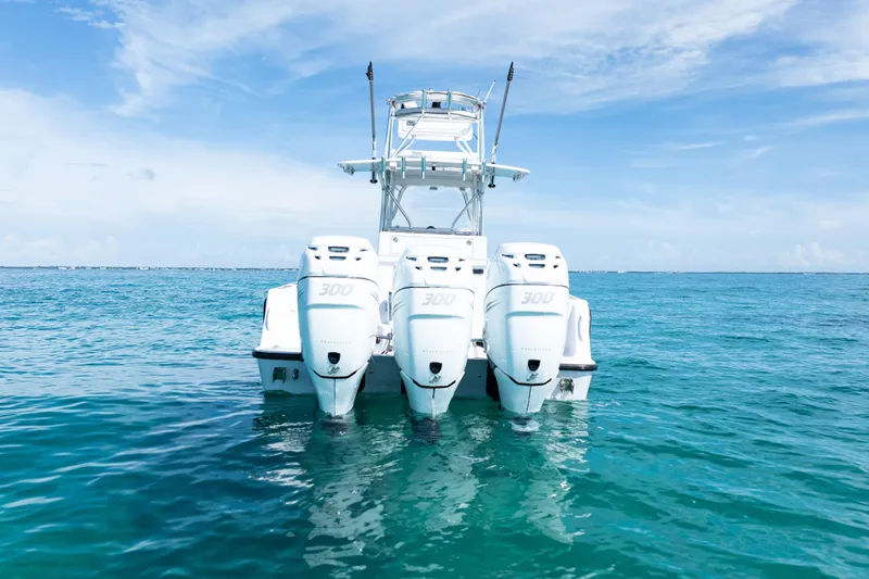  Yacht Photos Pics 2006 SeaVee 340B boat with triple 300 horsepower engines on open water.