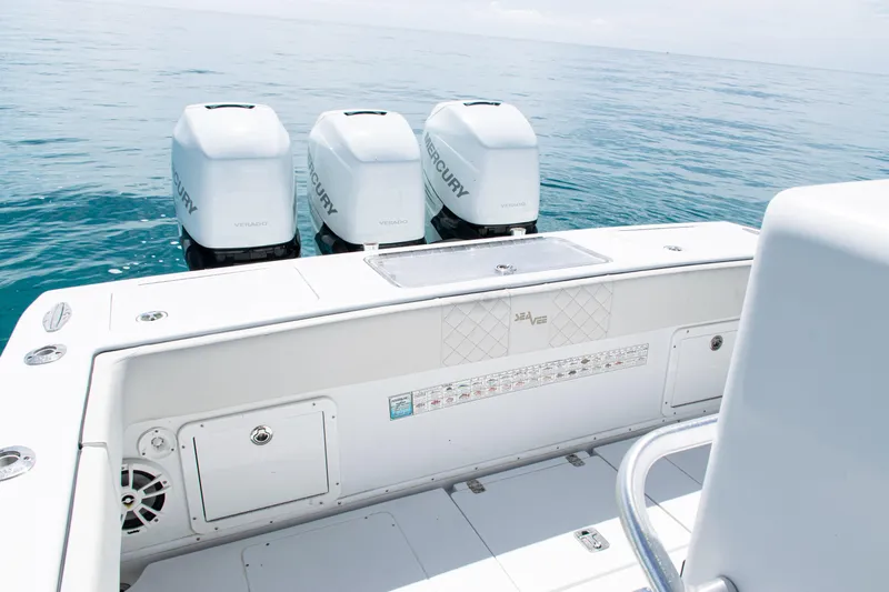  Yacht Photos Pics 2006 SeaVee 340B boat with triple Mercury engines on open water.