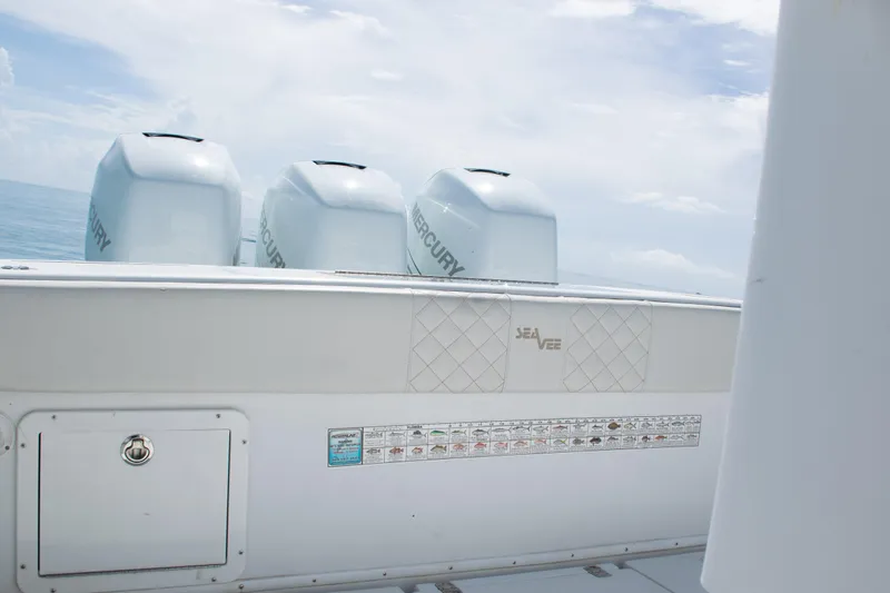  Yacht Photos Pics 2006 SeaVee 340B boat with Mercury engines, ocean backdrop, and fishing guide.