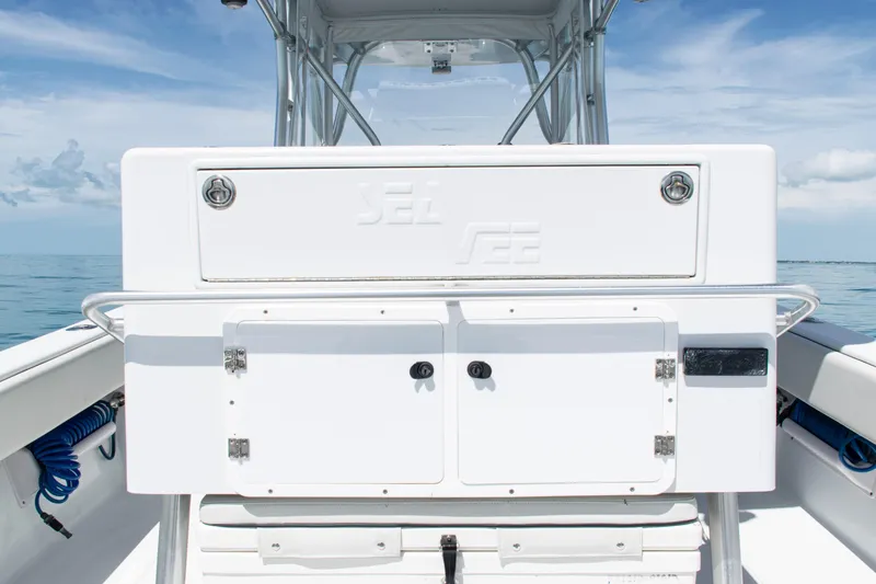  Yacht Photos Pics 2006 SeaVee 340B boat deck with storage compartments and ocean backdrop.