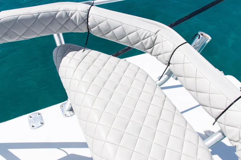  Yacht Photos Pics Quilted white seating on 2006 SeaVee 340B boat against blue water background.