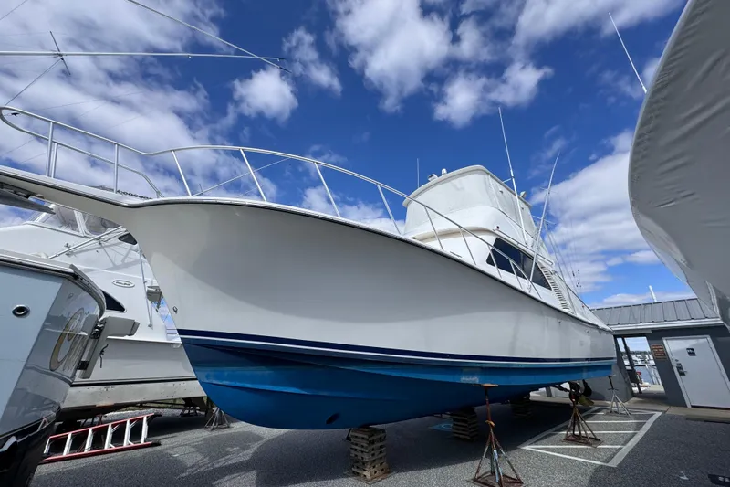 Ella Mae Yacht Photos Pics 2011 Henriques 42 Flybridge boat on stands under a blue sky.
