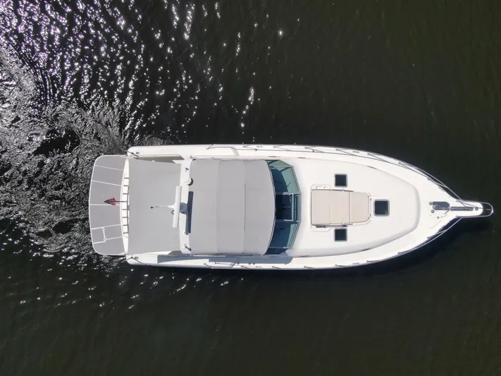 Sprout Yacht Photos Pics Aerial view of a 1995 Tiara Yachts 4000 Express cruising on water.