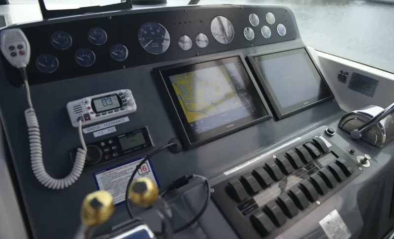 Sprout Yacht Photos Pics 1995 Tiara Yachts 4000 Express helm with navigation screens and control panel.