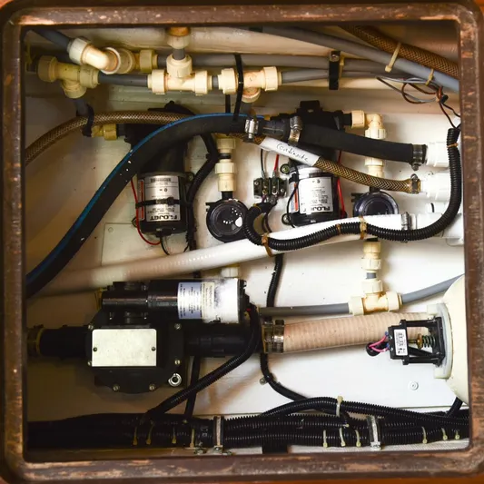 Sprout Yacht Photos Pics Engine compartment of a 1995 Tiara Yachts 4000 Express with various mechanical components.