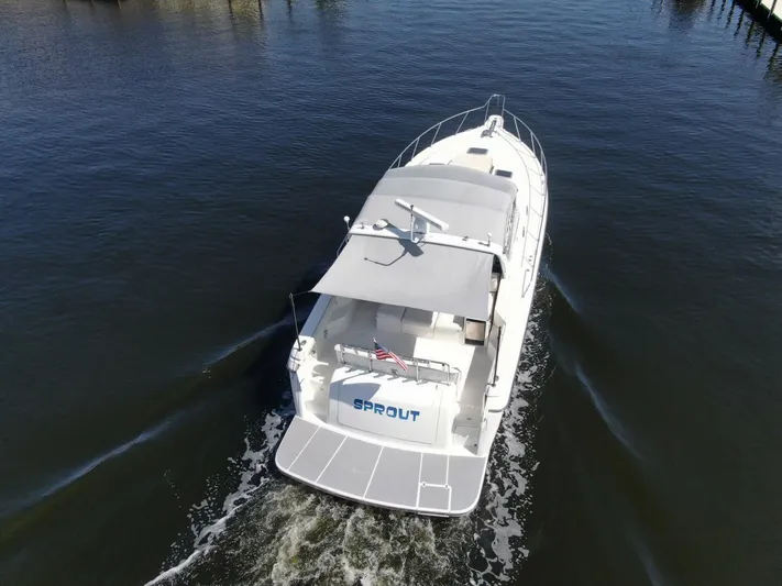 Sprout Yacht Photos Pics Aerial view of 1995 Tiara Yachts 4000 Express cruising on water.