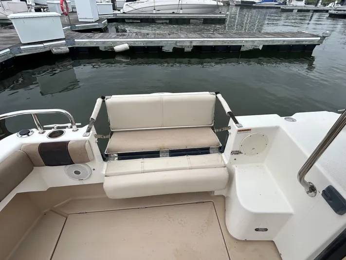 Yacht Photos Pics 2014 Cutwater C-30 Sedan boat interior with beige seating at a marina.