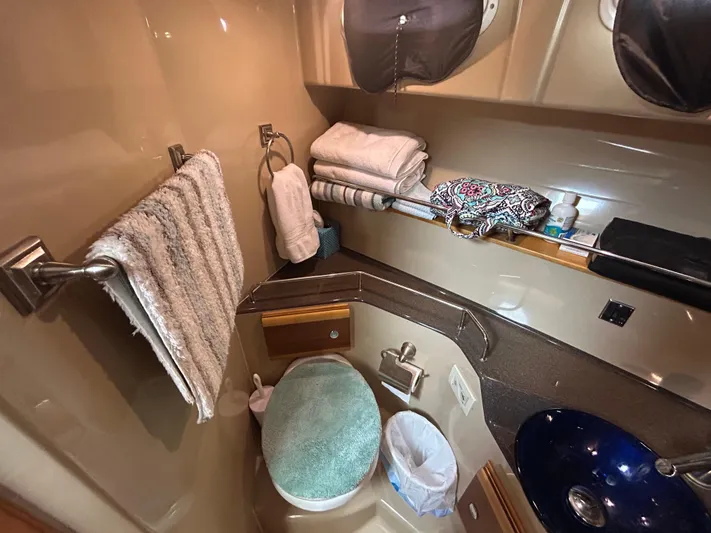  Yacht Photos Pics 2014 Cutwater C-30 Sedan bathroom with towels, sink, and storage.