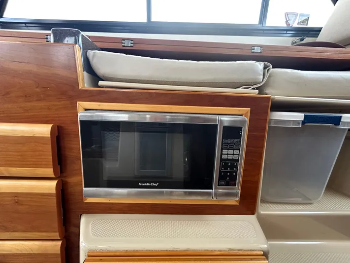 Yacht Photos Pics Microwave in 2014 Cutwater C-30 Sedan boat interior, wooden cabinetry.