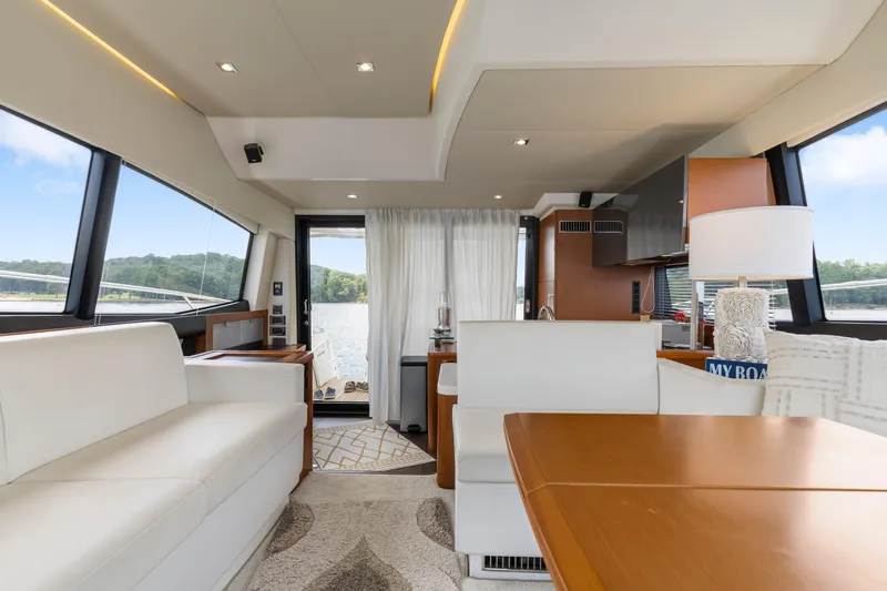  Yacht Photos Pics Luxurious interior of a 2017 Prestige 500 yacht with elegant furnishings and scenic views.