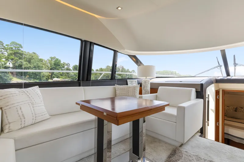  Yacht Photos Pics Luxurious interior of 2017 Prestige 500 yacht with elegant seating and panoramic windows.