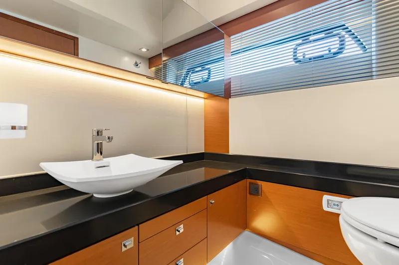  Yacht Photos Pics Luxurious bathroom interior of 2017 Prestige 500 yacht with modern sink and sleek design.