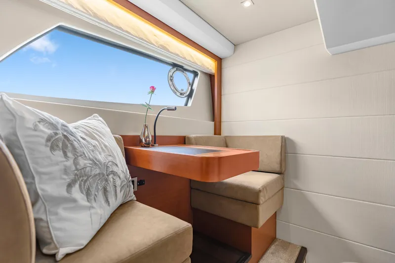  Yacht Photos Pics Luxurious interior of 2017 Prestige 500 yacht with elegant seating and window view.